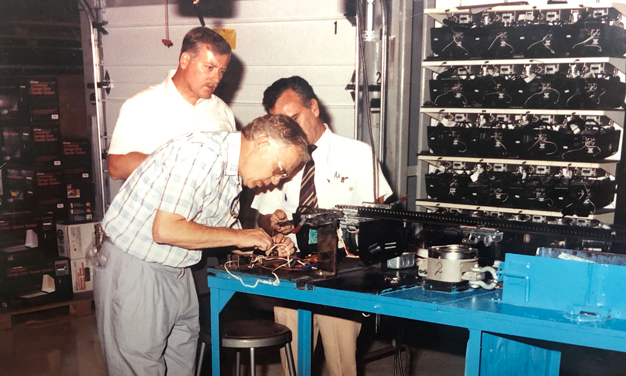 Garage door technicians inspecting equipment at Lloyd Copelan Garage Doors