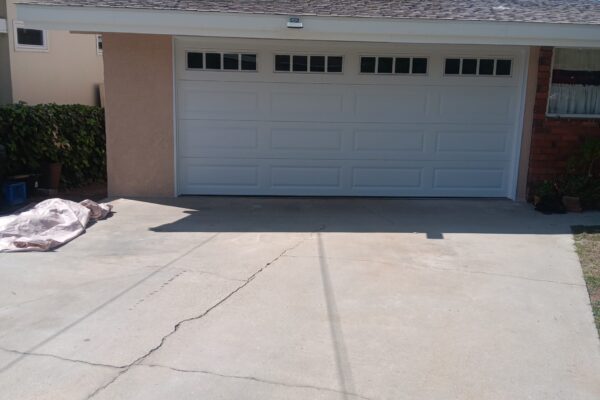 White double garage door installed at a single-story home in Redlands, CA.