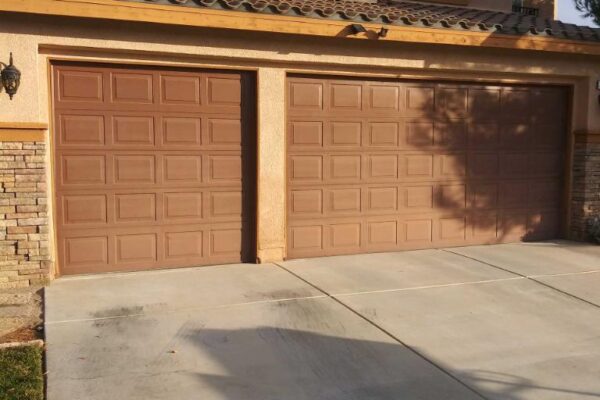 Brown garage doors on residential home exterior in Redlands CA