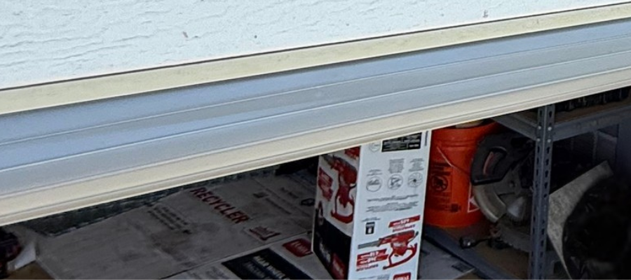 High-quality EPDM rubber garage door bottom seal installed on a home in Highland, CA, providing a precision-fit weather barrier.