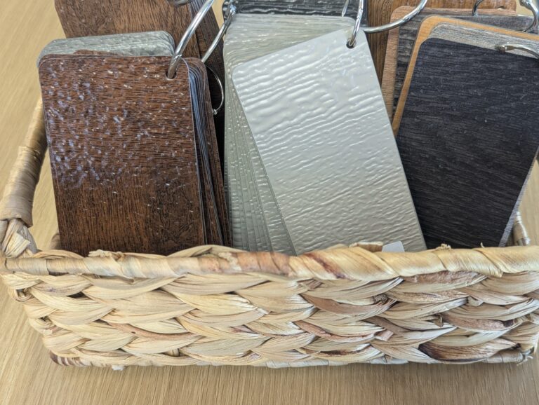 Close-up selection of garage door colors, woodgrain finishes, and textures