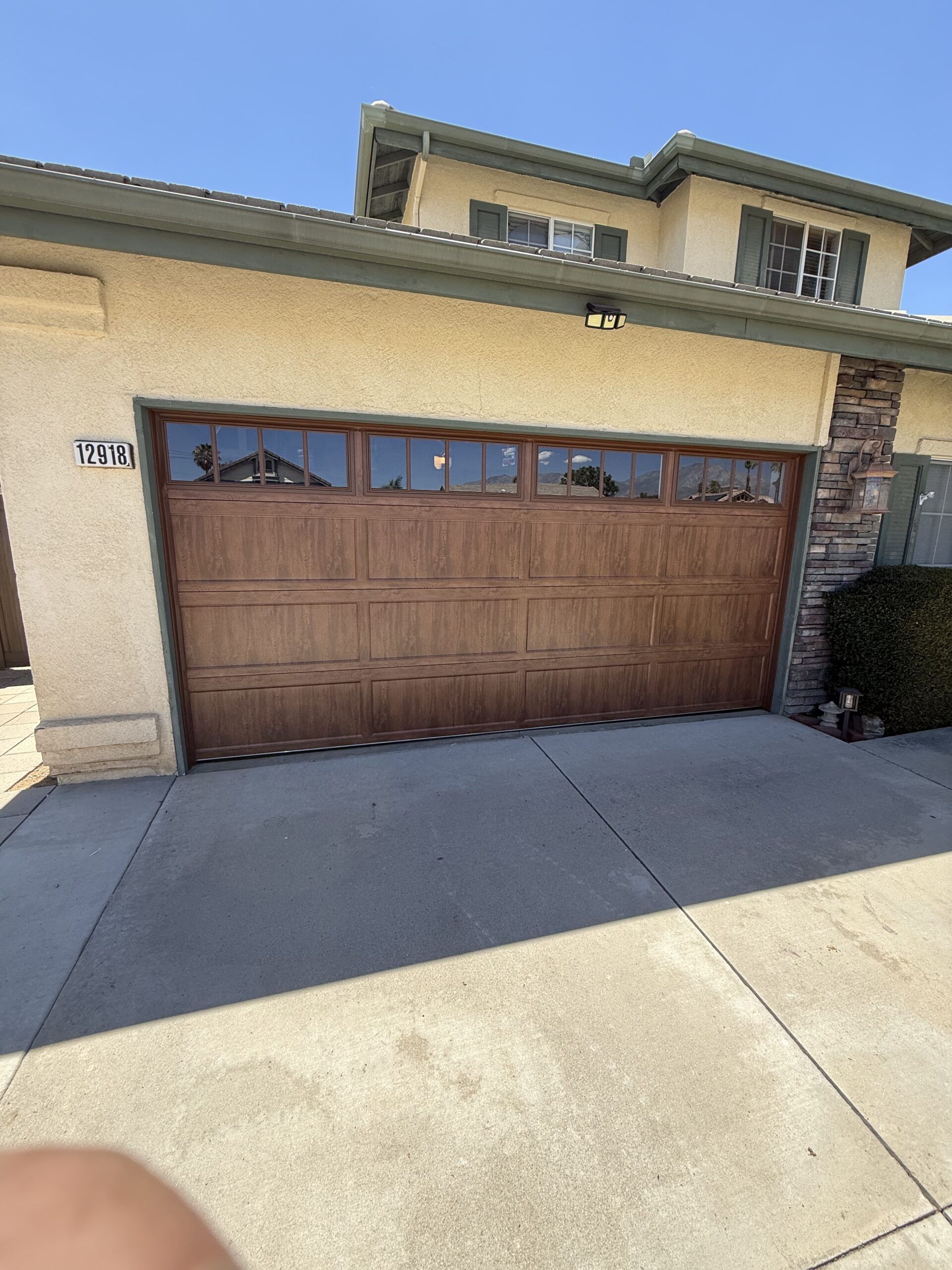 Clopay Bridgeport Ultra-Grain wood-look garage door after installation in Yucaipa