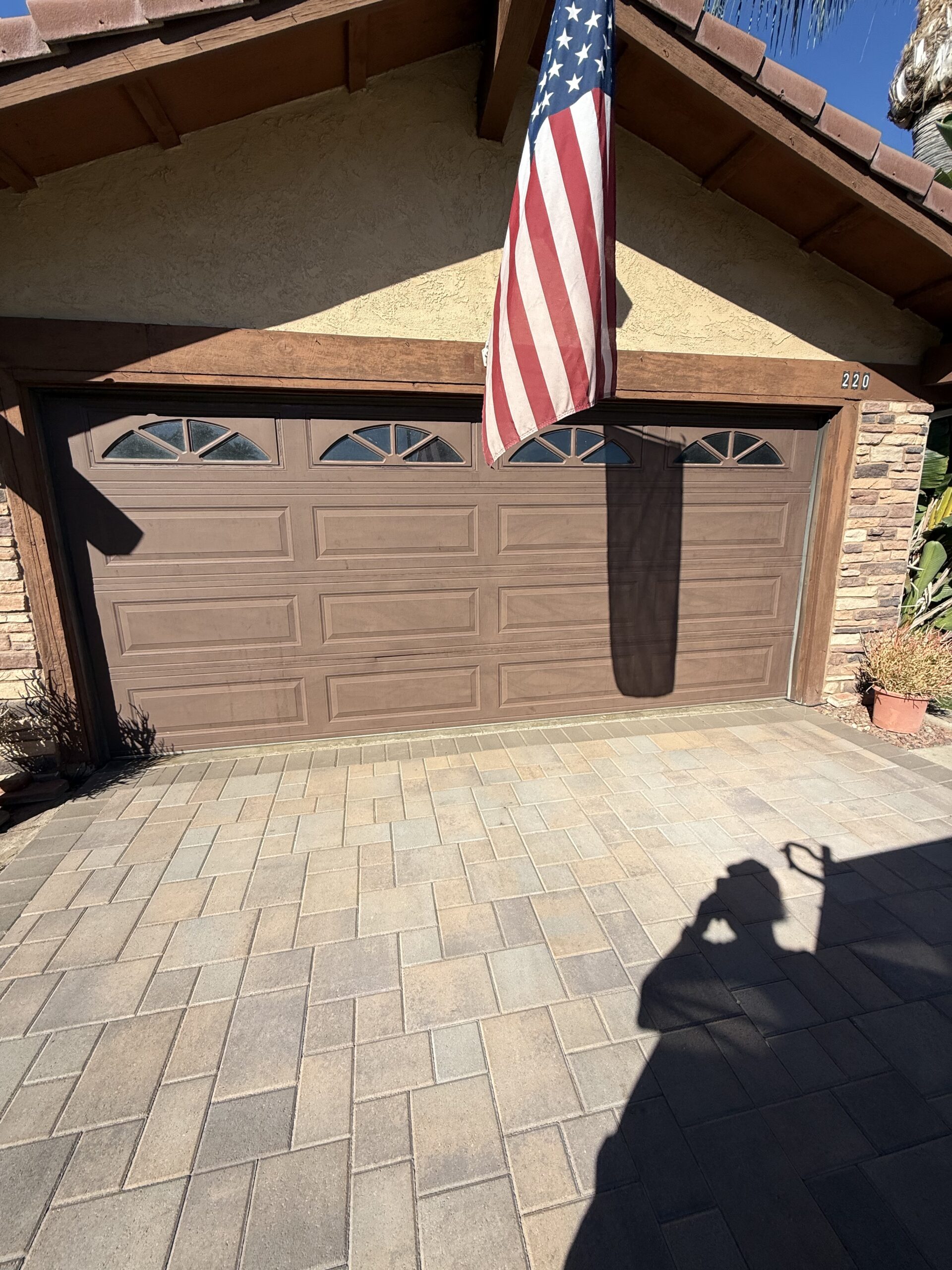 Before: existing garage door at a Redlands home ahead of an Ultra-Grain Gallery door installation.