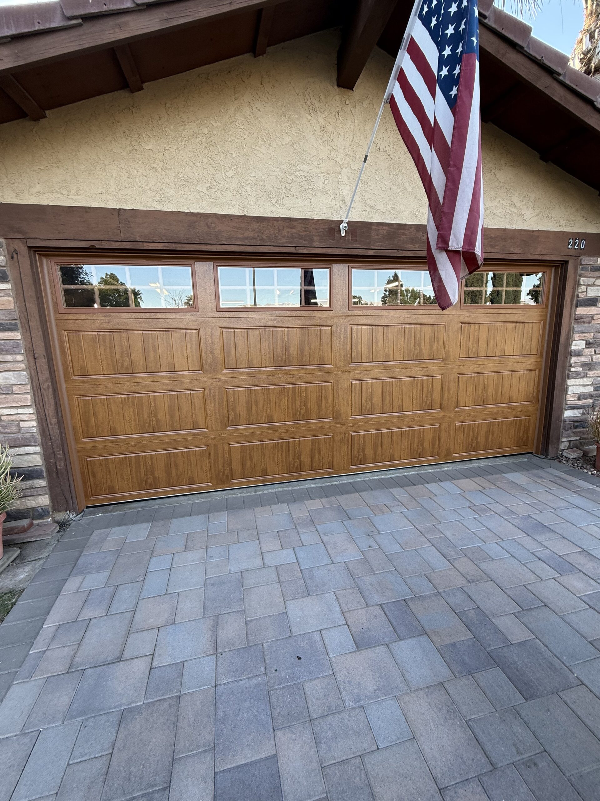 After: Ultra-Grain Gallery garage door with a wood-look finish in Redlands.