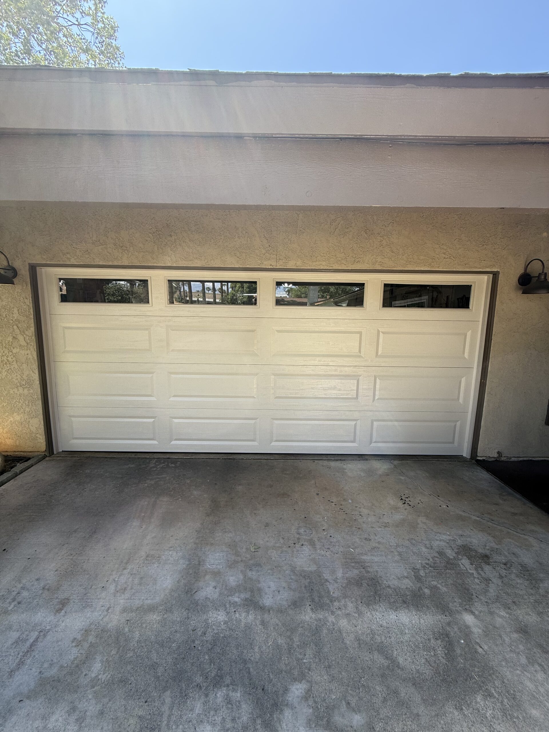 Classic Steel Value garage door in Desert Tan with Long Panels in Redlands.