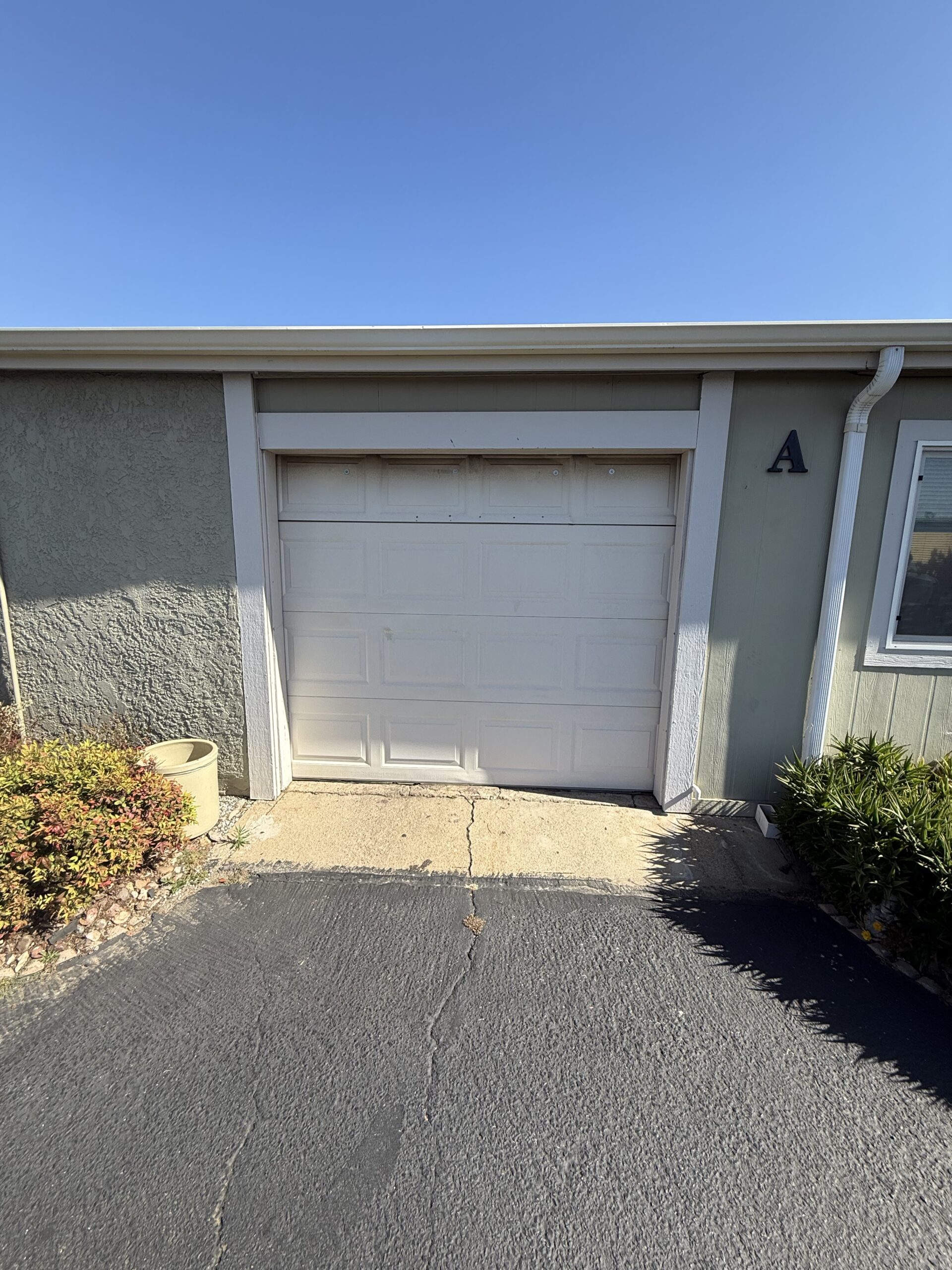 Before: existing garage door at a Yucaipa home ahead of a Classic Steel Value replacement.